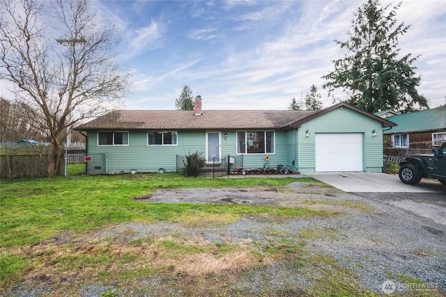 single story home featuring a front yard, fence, a chimney, a garage, and driveway