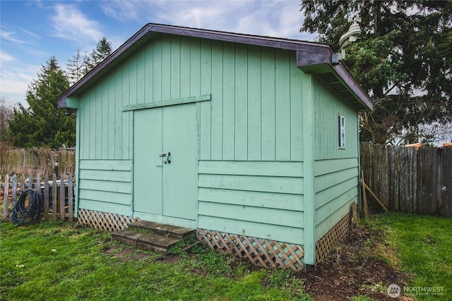 view of shed featuring a fenced backyard