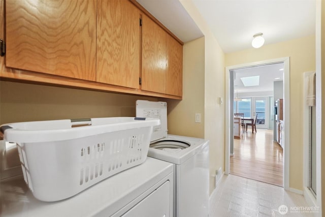 858 Livingston Bay Shore Dr, Camano Island, WA 98282 - washroom with baseboards, washing machine and clothes dryer, and cabinet space