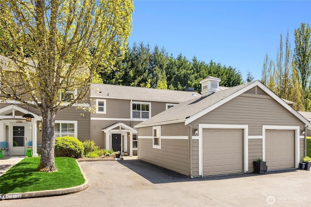 view of front of house with a shingled roof