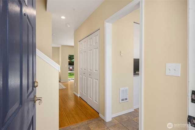 entryway with stairs, recessed lighting, baseboards, and visible vents