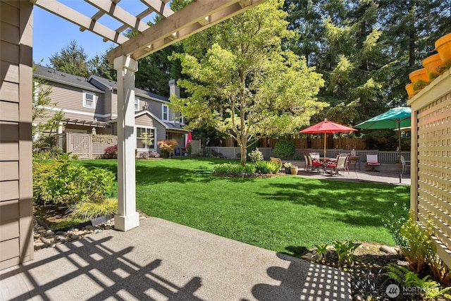 view of yard with fence, a pergola, and a patio