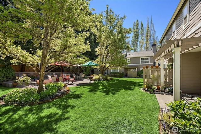view of yard with fence and a patio area