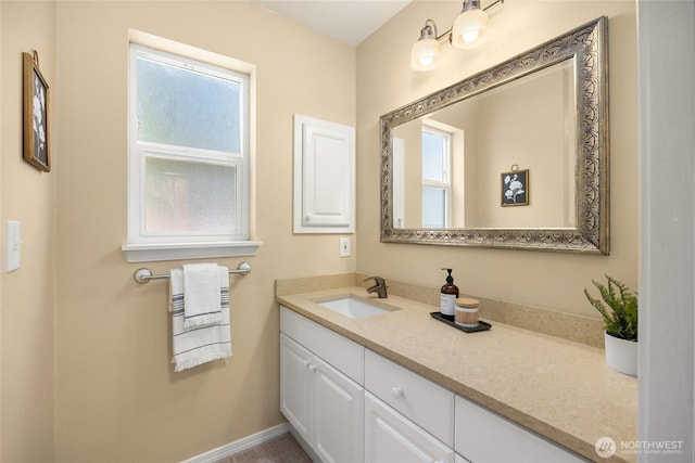 bathroom featuring a wealth of natural light and vanity