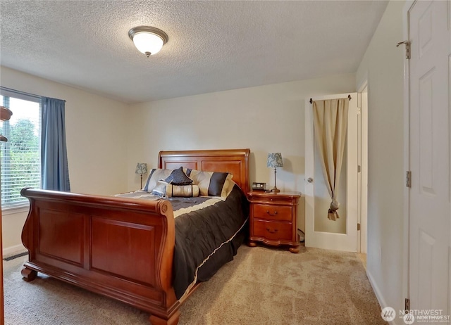 604 27th Ave SE, Puyallup, WA 98374 - bedroom featuring baseboards, light colored carpet, and a textured ceiling