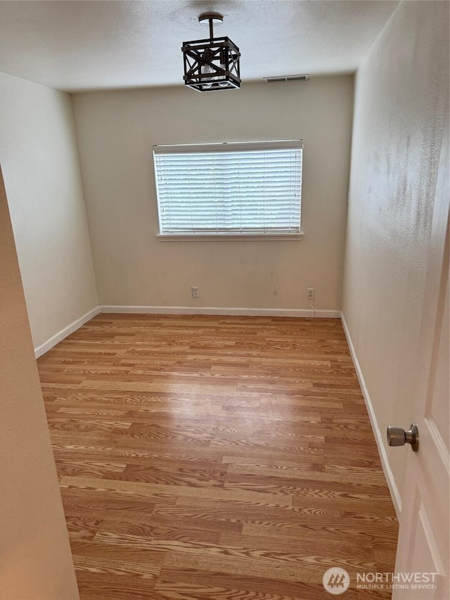 604 27th Ave SE, Puyallup, WA 98374 - unfurnished room with light wood-type flooring and baseboards