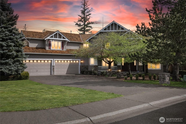2070 277th Ave SE, Sammamish, WA 98075 - view of front of property featuring driveway, a garage, a lawn, and stone siding