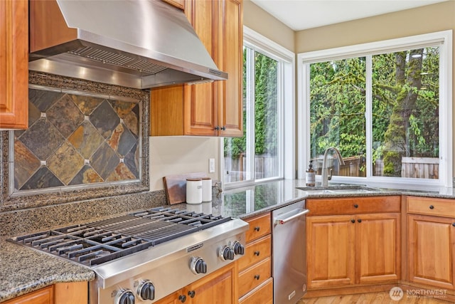 2070 277th Ave SE, Sammamish, WA 98075 - kitchen featuring wall chimney exhaust hood, stainless steel appliances, a sink, light stone counters, and tasteful backsplash