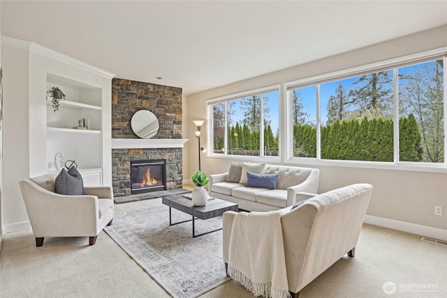 2070 277th Ave SE, Sammamish, WA 98075 - living area with baseboards, a fireplace, built in shelves, and carpet floors