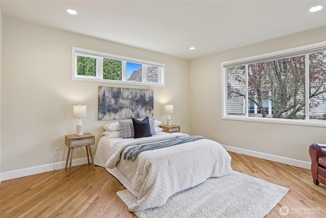 2070 277th Ave SE, Sammamish, WA 98075 - bedroom featuring multiple windows, baseboards, light wood finished floors, and recessed lighting