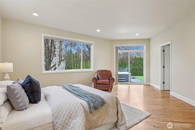 2070 277th Ave SE, Sammamish, WA 98075 - bedroom featuring access to outside, wood finished floors, recessed lighting, and baseboards