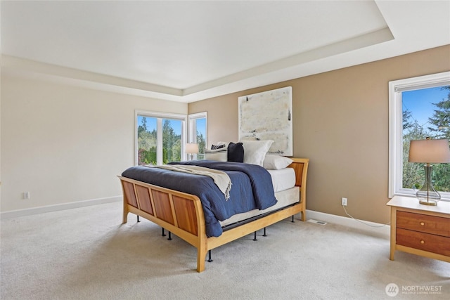 2070 277th Ave SE, Sammamish, WA 98075 - bedroom with light carpet, baseboards, and a tray ceiling