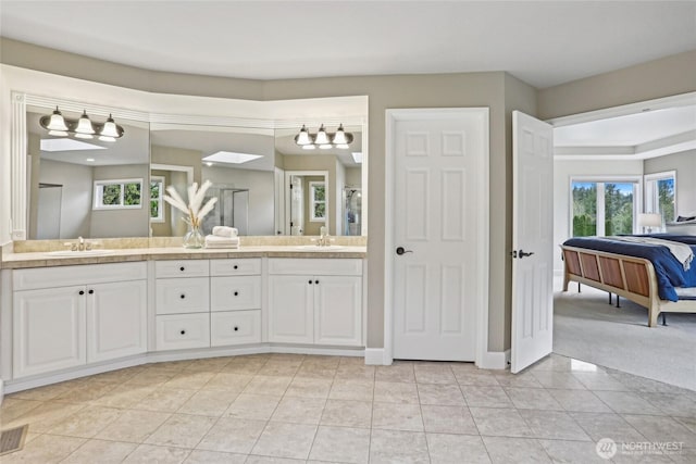 2070 277th Ave SE, Sammamish, WA 98075 - full bathroom featuring a shower, double vanity, ensuite bathroom, and tile patterned flooring