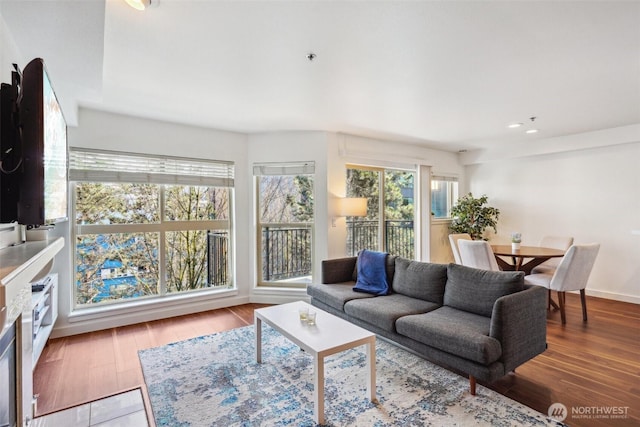 living room with recessed lighting and wood finished floors