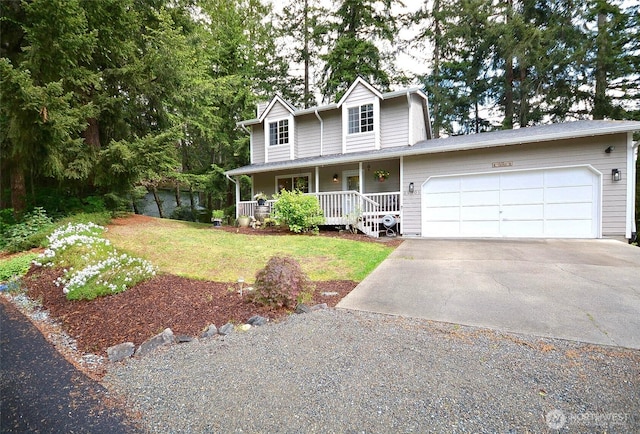 21901 N Clearlake Blvd SE, Yelm, WA 98597 - view of front of house featuring concrete driveway, a porch, an attached garage, and a front yard
