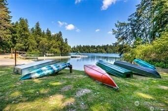 21901 N Clearlake Blvd SE, Yelm, WA 98597 - view of community featuring a water view, a forest view, a boat dock, and a lawn