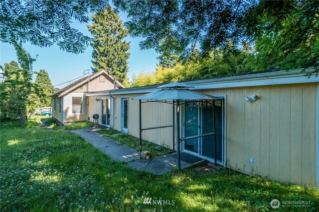 11709 26th Ave NE, Seattle, WA 98125 - back of property with a gazebo and a yard