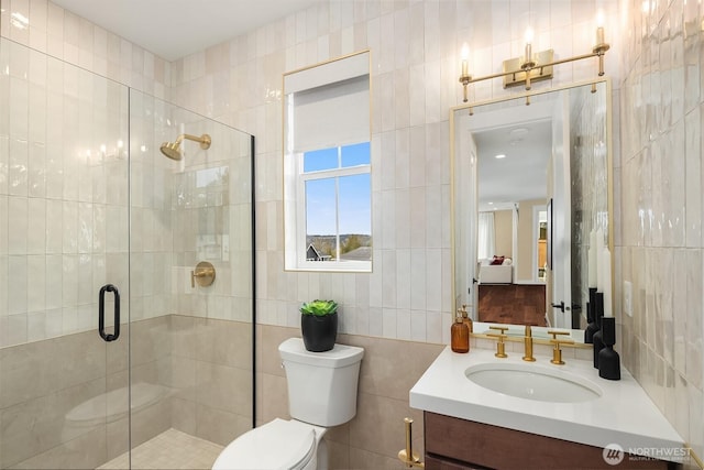 bathroom with toilet, tile walls, and a stall shower