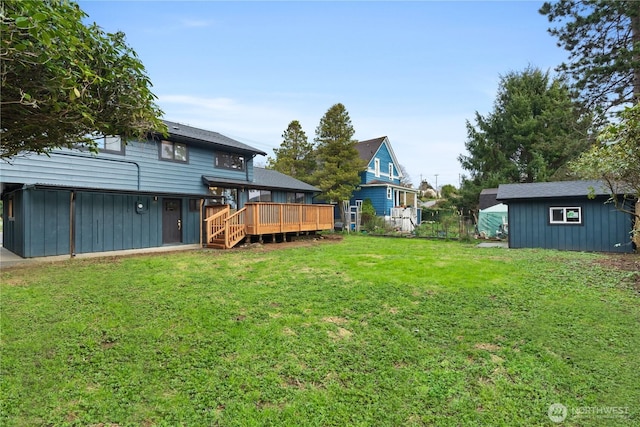 1309 W 5th St, Aberdeen, WA 98520 - view of yard featuring a storage unit, a wooden deck, and an outdoor structure