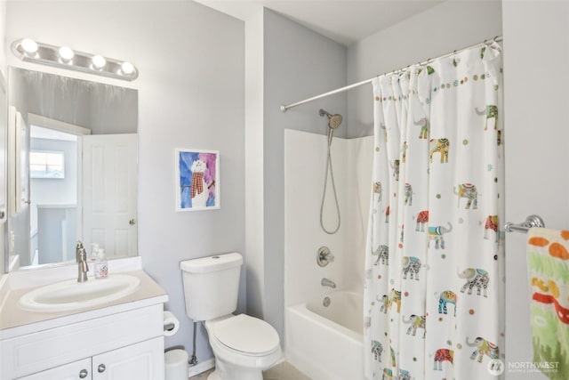 full bathroom featuring shower / bath combo, vanity, and toilet