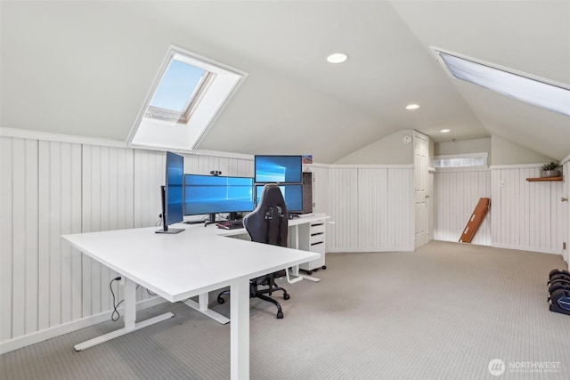 office featuring vaulted ceiling with skylight, carpet flooring, and recessed lighting