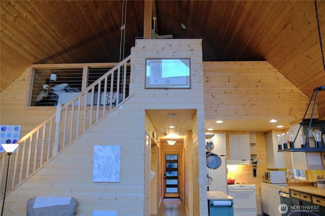863 Chinook Way, Anacortes, WA 98221 - interior space with wooden ceiling, wooden walls, and high vaulted ceiling