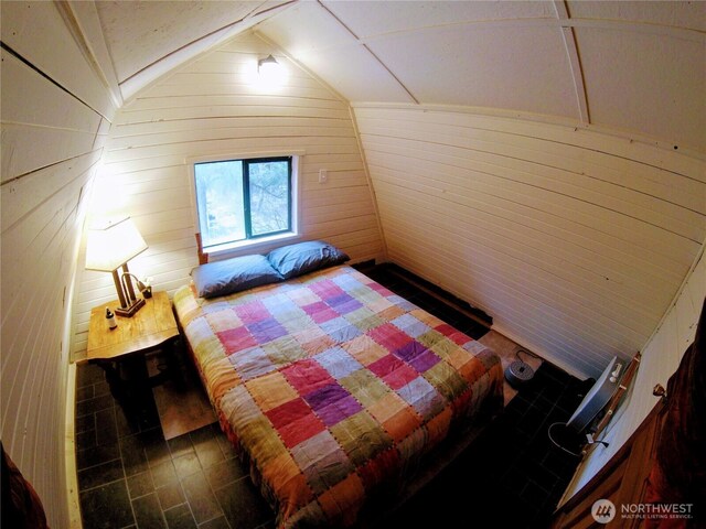 863 Chinook Way, Anacortes, WA 98221 - bedroom featuring wood walls and vaulted ceiling