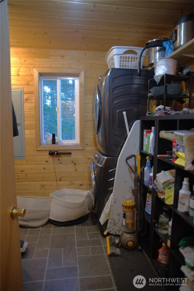 863 Chinook Way, Anacortes, WA 98221 - clothes washing area featuring laundry area, stacked washer / drying machine, and wooden walls