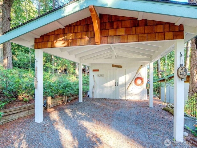 view of vehicle parking featuring a carport