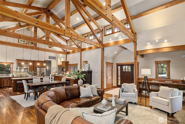 121 Hard Scrabble Ln, Cle Elum, WA 98922 - living room featuring dark wood-style flooring, high vaulted ceiling, beam ceiling, and recessed lighting