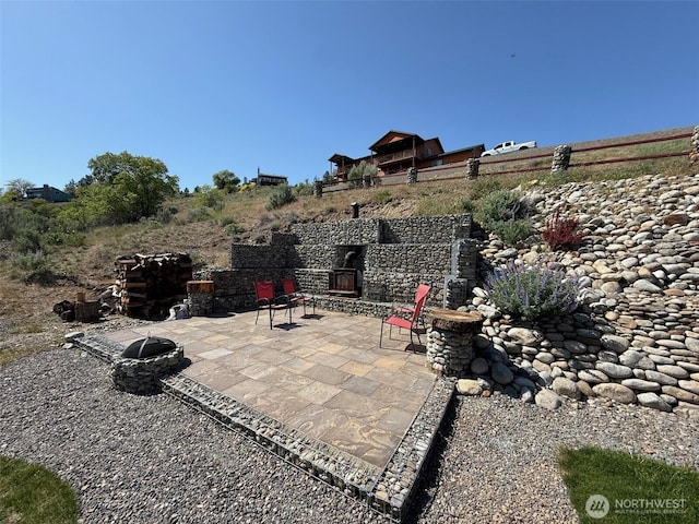 view of patio featuring an outdoor fire pit