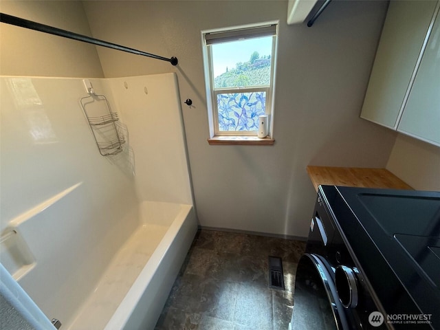 full bath featuring vanity, shower / bathing tub combination, baseboards, and visible vents