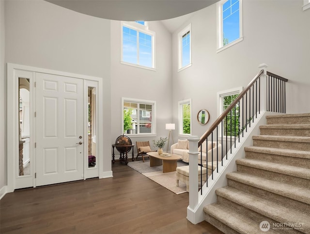 1497 Elk Run Pl SE, North Bend, WA 98045 - foyer entrance featuring dark wood-style flooring, stairway, a high ceiling, healthy amount of natural light, and baseboards