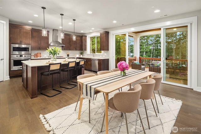 1497 Elk Run Pl SE, North Bend, WA 98045 - dining space featuring wood finished floors and recessed lighting