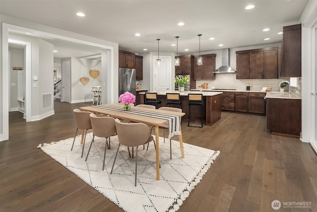 1497 Elk Run Pl SE, North Bend, WA 98045 - dining space with stairway, dark wood-style floors, recessed lighting, and baseboards