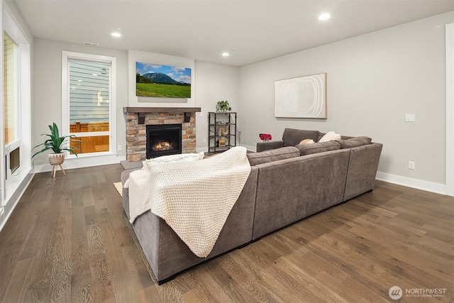 1497 Elk Run Pl SE, North Bend, WA 98045 - living area featuring a fireplace, baseboards, dark wood finished floors, and recessed lighting