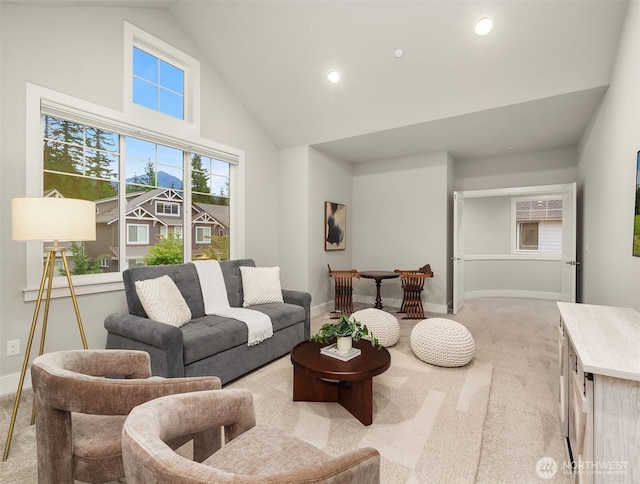 1497 Elk Run Pl SE, North Bend, WA 98045 - living room with light colored carpet, high vaulted ceiling, baseboards, and recessed lighting
