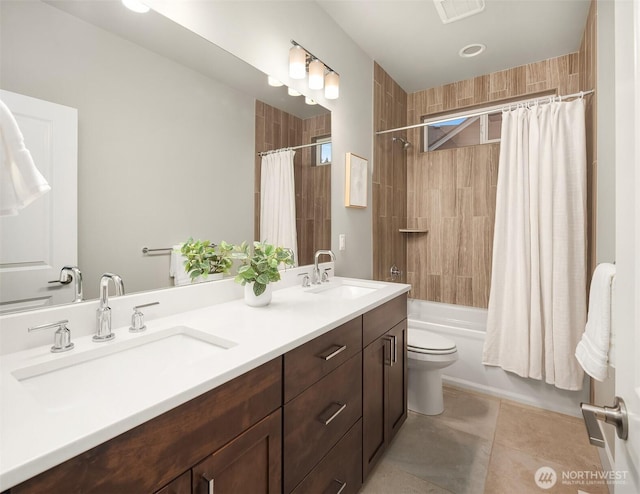 1497 Elk Run Pl SE, North Bend, WA 98045 - full bath with double vanity, toilet, shower / bath combo, and tile patterned flooring