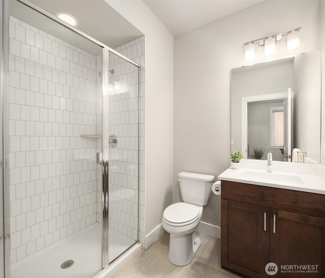 1497 Elk Run Pl SE, North Bend, WA 98045 - full bath featuring vanity, a stall shower, toilet, and tile patterned floors