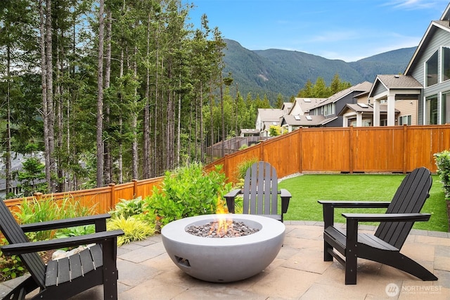 1497 Elk Run Pl SE, North Bend, WA 98045 - view of patio / terrace featuring a fire pit and a mountain view
