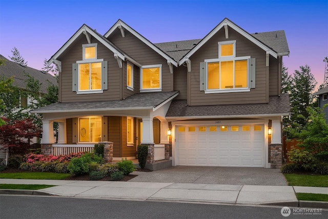 1497 Elk Run Pl SE, North Bend, WA 98045 - craftsman inspired home with roof with shingles, an attached garage, covered porch, and asphalt driveway