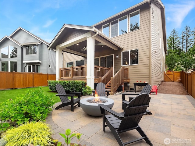 1497 Elk Run Pl SE, North Bend, WA 98045 - back of house featuring an outdoor fire pit, a patio, and a fenced backyard