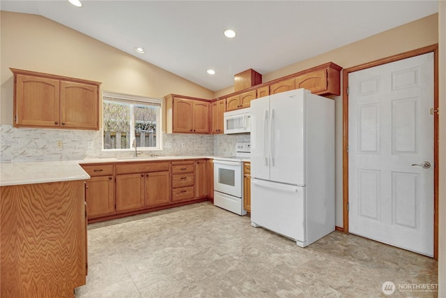 1529 Thompson Dr, Camano Island, WA 98282 - kitchen featuring vaulted ceiling, white appliances, light countertops, and a sink