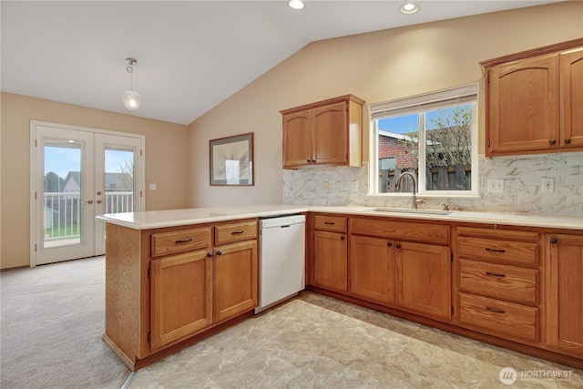 1529 Thompson Dr, Camano Island, WA 98282 - kitchen featuring a peninsula, lofted ceiling, a sink, light countertops, and dishwasher