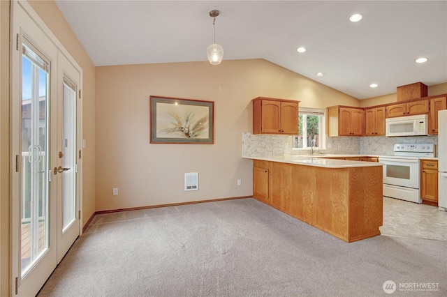 1529 Thompson Dr, Camano Island, WA 98282 - kitchen with tasteful backsplash, visible vents, light countertops, lofted ceiling, and white appliances