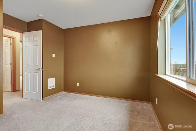 1529 Thompson Dr, Camano Island, WA 98282 - unfurnished room with baseboards and light carpet