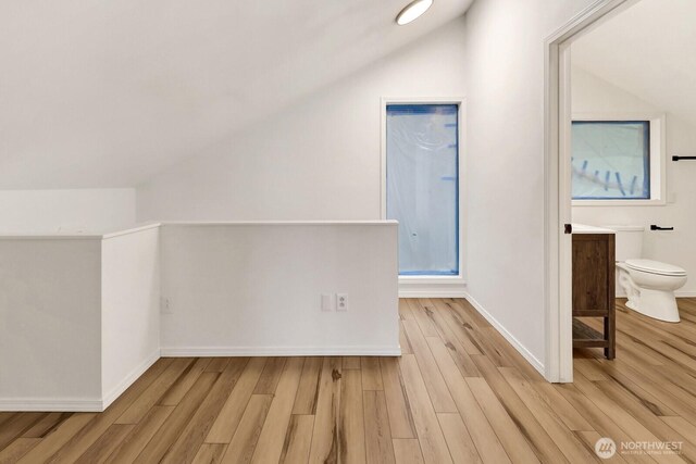 13574 S Green St, Anacortes, WA 98221 - additional living space featuring baseboards, light wood finished floors, and lofted ceiling