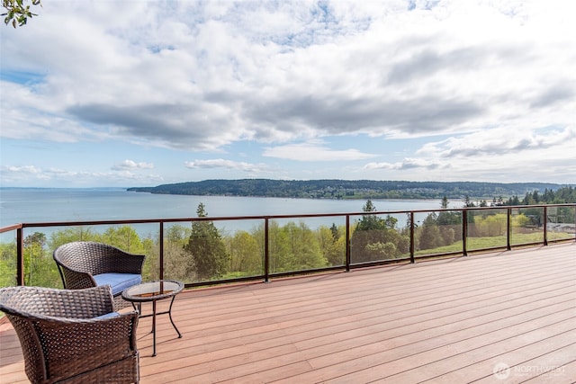 wooden terrace with a water view