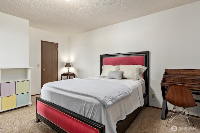 carpeted bedroom featuring a textured ceiling