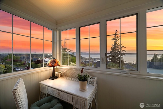 sunroom with a water view